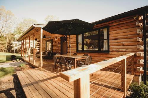 Welcoming Front Porch at Log Cabin Vacation Rental